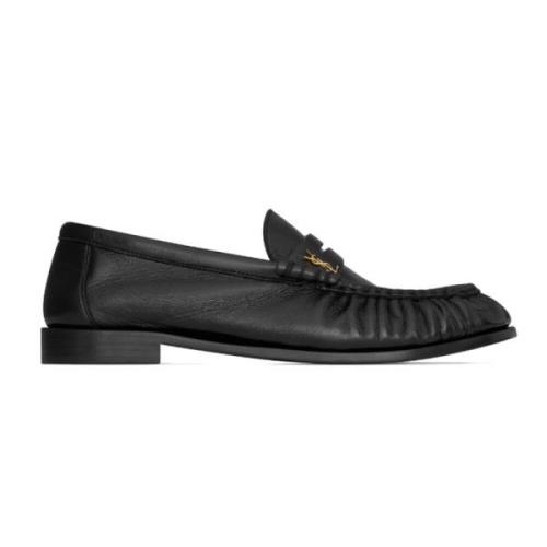 Sorte skinnloafers med Cassandre-logo